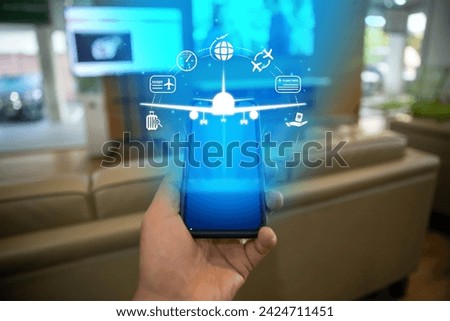 Flight ticket booking concept with a person using a smartphone Royalty-Free Stock Photo #2424711451
