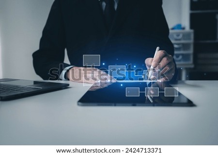 Person with hologram flowchart, businessman designing flowchart business workflow to systematically qualitatively, flowcharting to visualize the workflow of the program. Flowchart design concept.