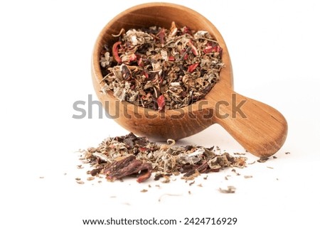 Scorpio Tea Leaf Blend Spilled from a Wood Scoop