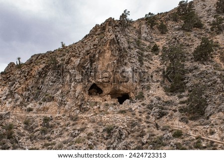 Cave entrances to Mitchell caverns. Royalty-Free Stock Photo #2424723313