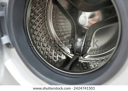 Close up of a washing machine drum. Shallow depth of field.