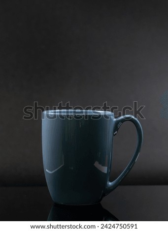 Blue mug isolated on a black background