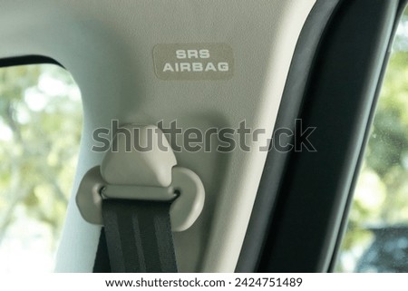 Supplemental Restraint System airbag sign or sticker in a car. Royalty-Free Stock Photo #2424751489