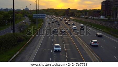 Wide highway captured from air cars zooming on road continuous stream of movement Road signifies constant motion asphalt pathways alive. Road traffic symbolizes bustling life dynamic movement.