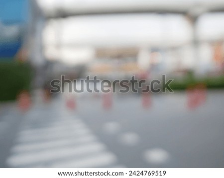 Blur focus of Crosswalk and pedestrian at modern city zebra crossing street