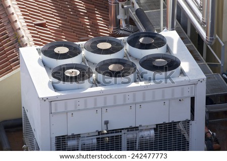 View of a huge group of air conditioning on a roof. Royalty-Free Stock Photo #242477773