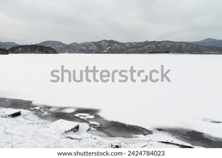 View of the snow-covered lake in winter