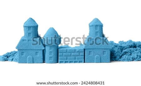 Castle made of blue kinetic sand isolated on white Royalty-Free Stock Photo #2424808431