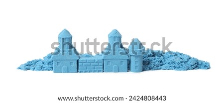 Castle made of blue kinetic sand isolated on white Royalty-Free Stock Photo #2424808443