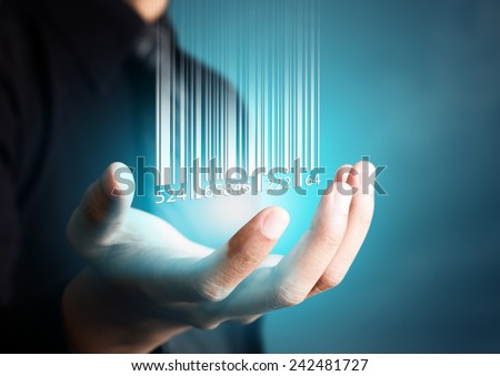 Barcode dropping on businessman hand, financial concept Royalty-Free Stock Photo #242481727