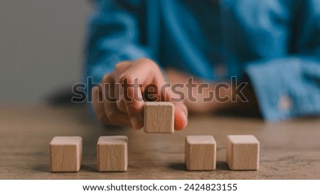 Blank wooden cubes on the table with copy space, empty wooden cubes for input wording, and an infographic icon.