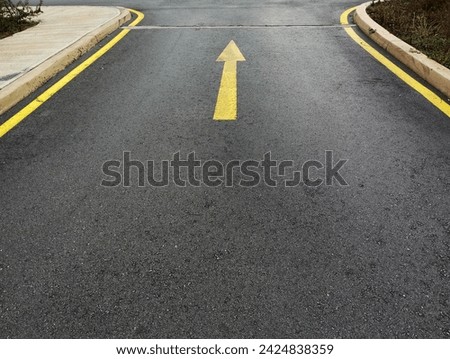black ground asphalt one-way traffic passing direction, forward direction