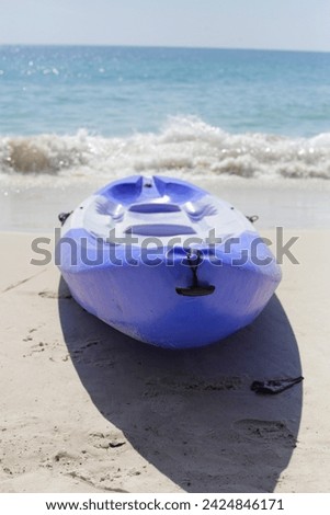 Plastic kayak sea on the beach Royalty-Free Stock Photo #2424846171