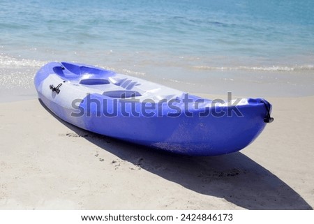 Plastic kayak sea on the beach Royalty-Free Stock Photo #2424846173