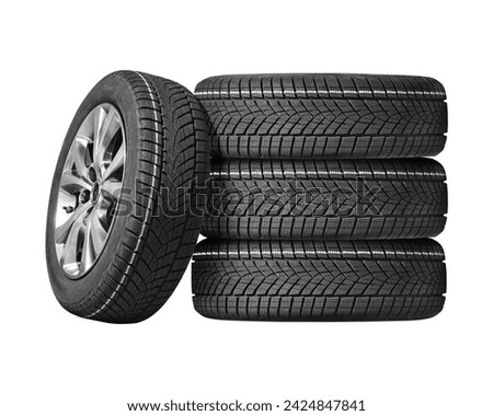 Car tires with a great profile in the car repair shop. Set of summer or winter tyres in front of white fond. On transparent PNG background. Royalty-Free Stock Photo #2424847841