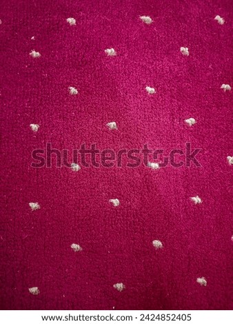 Seamless close up of dot red maroon carpet texture background from above, Elegance red color carpet texture Red carpet