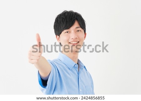 Asian man thumbs up gesture in white background