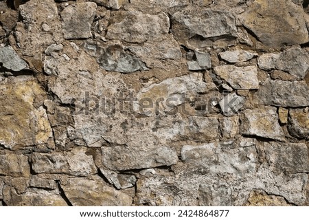 old stone wall closeup, brown background