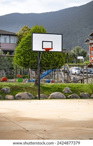 Basketball hoop on the street. Play and sports area idea concept for kids. Outdoor. Vertical photo. Freestyle basketball. No people, nobody. 