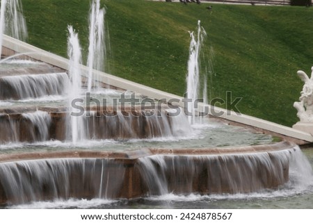 Artistic fountain in a park of Vienna, Austria Royalty-Free Stock Photo #2424878567