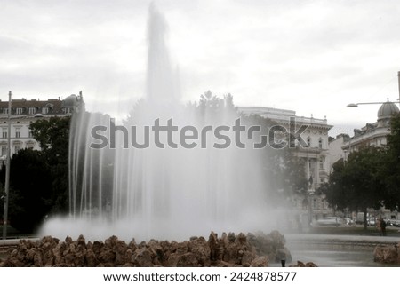 Artistic fountain in a park of Vienna, Austria Royalty-Free Stock Photo #2424878577