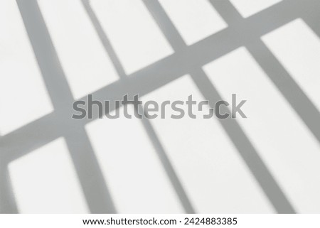 Gray shadow and light blur abstract background on white wall  from window. Dark stripe grey shadows indoor in room  background, monochrome, shadow overlay effect for backdrop and mockup design

