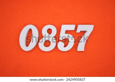 Orange felt is the background. The numbers 0857 are made from white painted wood.