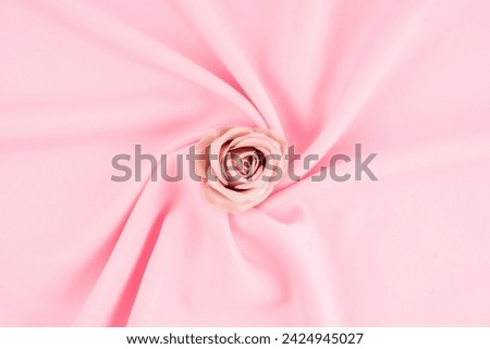 Romantic pastel pink color satin and rose flower. Valentine's Day concepts.