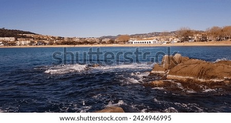 beach rocks blue sea catalunia coast Royalty-Free Stock Photo #2424946995