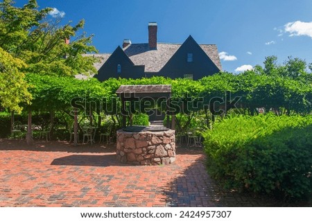 A stone well at the house of the seven gables in Salem Massachusetts on a sunny day. Royalty-Free Stock Photo #2424957307