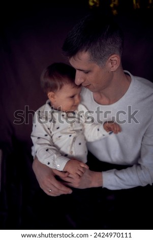               dad kisses and hugs his little son                 