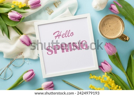 Elevate your day with the Hello Spring vibe. Top view of a photo frame proclaiming "Hello Spring," trendy sunglasses, scarf, aromatic coffee, pen, mimosa, and tulips on a pastel blue backdrop