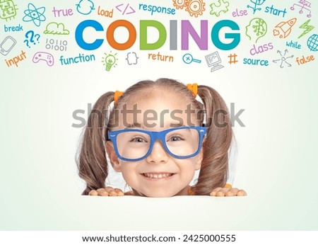 Beautiful cute little girl with eyeglasses looking at camera while colorful CODING word, symbols and commands above her head. Coding for kids. Programming languages concept.