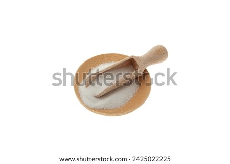 Food additive E575 in wooden scoop on white background. Glucono-delta-lactone, also known as gluconolactone. Pure GDL, white odorless crystalline powder Produced by the aerobic oxidation of glucose. Royalty-Free Stock Photo #2425022225