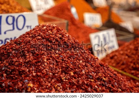 A large amount of hot red pepper flakes from the chili pepper vendor, Royalty-Free Stock Photo #2425029037