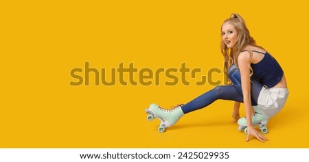 Stylish young woman in vintage roller skates on yellow background with space for text