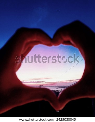 Couple heart for special day like monthsary, anniversary or valentines. Raw photo of heart sign with actual sky and sunset background