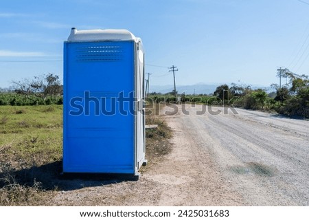 Portable Toilet in a Rural Street, Environmental Care Concept