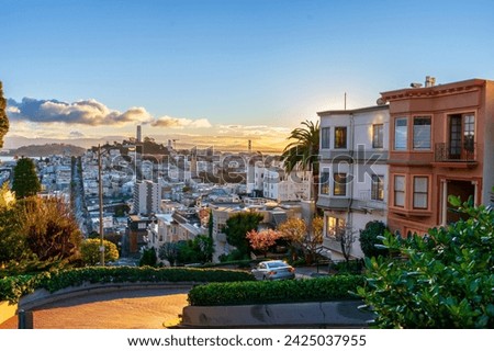 The crookedest street in the world Lombard Street. San Francisco is lightened by morning sun. View from top point of famous street.