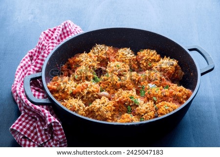 Ground beef and rice Porcupine (hedgehog) meatballs, cooked in a rich tomato sauce. 