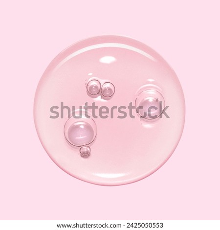 Serum oil sample swatch round shape texture isolated on pink background. cosmetic Hyaluronic acid retinol collagen science lab product 