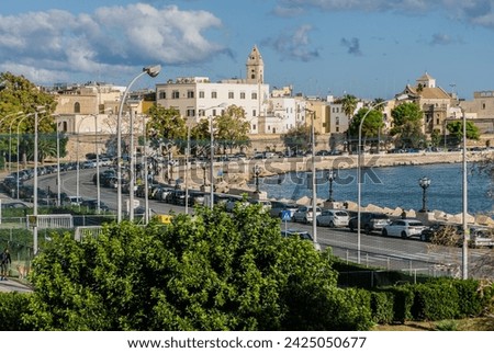 Waterfront of Lungomare Imperatore Augusto street in Bari with harbour in the background. Bari, Puglia region (Apulia), southern Italy, Europe,  Royalty-Free Stock Photo #2425050677