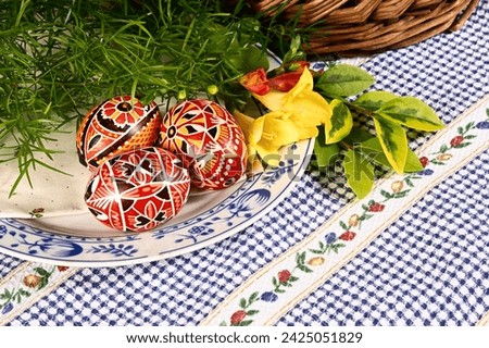 Easter, spring holiday - beautiful colorful Easter eggs - Czech home tradition of decorating with wax,
classic still life with spring flowers,