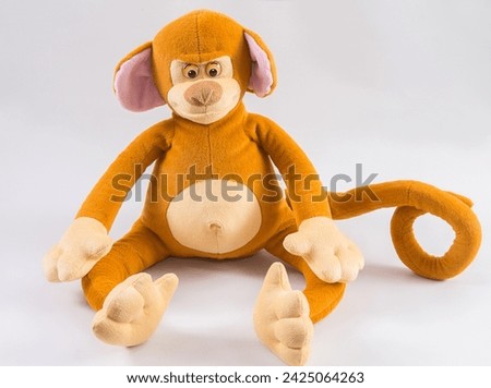 Plush children's toy monkey on a white background.
