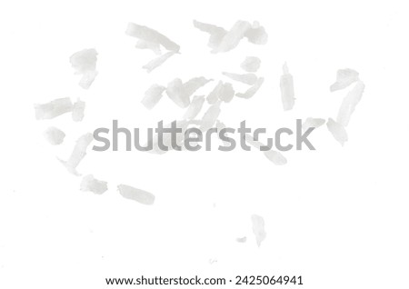 Fresh coconut flakes on white background, top view. Close up Royalty-Free Stock Photo #2425064941