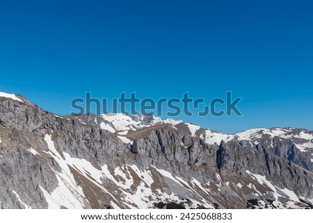 Panoramic view of majestic mountain peak Ringkamp in untamed Hochschwab mountain region, Styria, Austria. Scenic hiking trail on blue sky sunny day in remote Austrian Alps. Wanderlust in alpine spring
