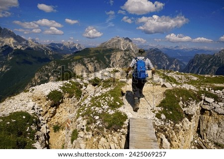 Hikers explore the  World War I trenches in the mountain top of Monte Piana,Dolomites Alps, Italy Royalty-Free Stock Photo #2425069257