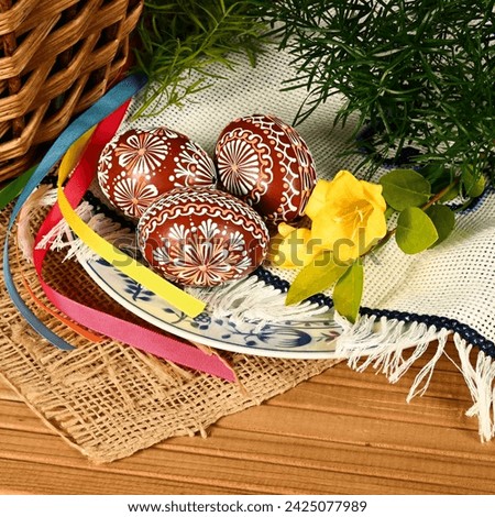 Easter, spring holiday - beautiful colorful Easter eggs - Czech home tradition of decorating with wax,
classic still life with spring flowers,