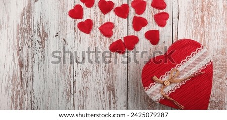 Valentine's Day concept banner with handmade gift box, and a lot of hearts on a wooden background. ?opy space