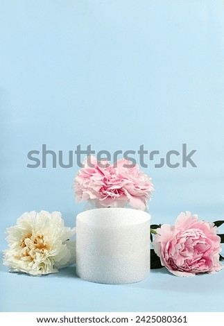 Abstract floral arrangement, empty podium for product and fresh peony flowers,Stage for demonstrating product and business concept. Minimal modern aesthetics. elegant beauty concept, selective focus